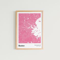 a framed map of boston in pink and white