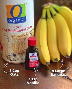 ingredients to make oatmeal sitting on a table with bananas and other items