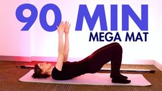 a woman is doing yoga in front of a sign that says 90 min mega mat