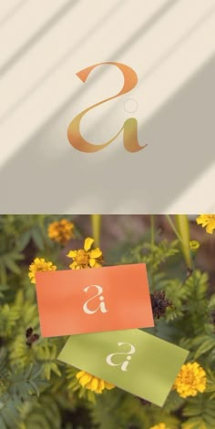 three different logos that are on top of each other in front of some yellow flowers