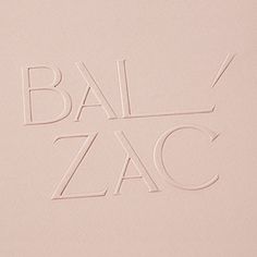 an image of the word balzac written in cursive writing on paper