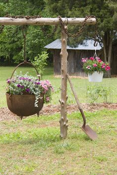 two hanging planters with flowers in them