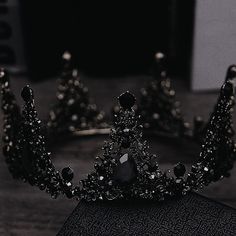 a black tiara sitting on top of a book