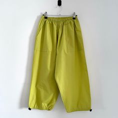 Description: Vintage Green Yellow Cropped 90s Cargo Pants Trousers. Made in England. 65% Polyester, 35% Viscose Measurementsstrong>Waist: 61cm, Inside Leg: 46cm, Outside Leg: 80cm 90s Style Baggy Wide Leg Bottoms, Spring Baggy Wide-leg Parachute Pants, Oversized Wide Leg 90s Bottoms, 90s Style Oversized Wide Leg Bottoms, 90s Oversized Wide Leg Bottoms, Retro Baggy Wide-leg Bottoms, Retro Baggy Wide Leg Bottoms, 90s Style Relaxed Fit Wide Leg Bottoms, 90s Relaxed Fit Wide Leg Bottoms