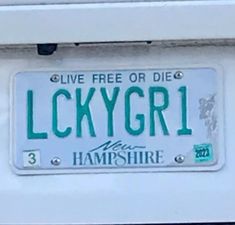 a license plate that reads luckygirl on it's front and back side, with the words live free or die