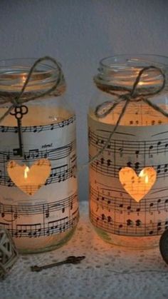 two mason jars with musical notes and heart lights