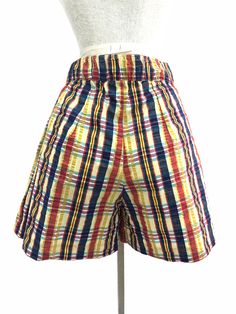 "Vintage 1970s plaid multicolored high rise shorts with zip closure up the front MEASUREMENTS: Length: 165.\" Waist: Up to 26\" Inseam: 4\" Hip: 40\" All measurements taken with garment laid flat. Modern Size Estimate: S/M CONDITION: Excellent Vintage Condition All items at Time Warp are vintage, so there is some wear. They may not be 100% free of minor defects, as they have already been loved. We list items by condition and note any flaws. Find us on Instagram: @timewarpbr INV 2372" Retro High Waist Multicolor Shorts, Vintage Multicolor Short Bottoms, Vintage Multicolor Short Length Bottoms, Retro Multicolor Shorts, Decades Outfits, 70s Plaid, 80s Denim, Paint Shirts, Time Warp