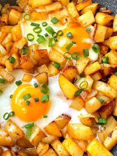 an egg is on top of potatoes in a skillet