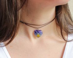 Violet flowers have the ability to hear other people's thoughts. This flower necklace choker, part of my pansy jewelry, has a beautiful story behind. Do you want to hear it? Miguel was a shy boy who had no friends. His only friend was a pansy flower that grew in a corner of his village. When Miguel talked to her, she listened to his words and thoughts, and little by little that beautiful flower gave Miguel love and self-esteem to fill him with happiness and friends 🌸 This flower necklace choker Adjustable Jewelry With Flower Charm For Valentine's Day, Adjustable Choker Flower Necklace For Gift, Adjustable Flower-shaped Jewelry For Valentine's Day, Adjustable Flower Shaped Jewelry For Valentine's Day, Flower Charm Choker As A Gift, Flower Shaped Choker With Flower Charm As Gift, Floral Choker With Flower Charm As A Gift, Adjustable Flower Charm Choker, Gift Flower Pendant Adjustable Choker