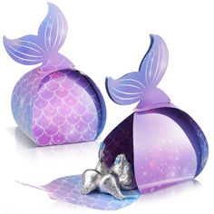 two purple and blue bags with mermaid tails on them