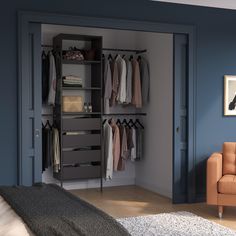 an open closet with clothes hanging on the wall and a chair in front of it