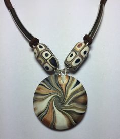 Hand crafted Black / Beige / White earrings with sterling silver hooks and necklace .Earring and necklace are done using Polymer clay with Suede Leather Cord Custom Business Cards, Swirl Design, White Earrings, Handmade Polymer Clay, Leather Cord, Suede Leather, Washer Necklace, Jewelry Sets, Swirl