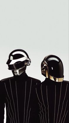 two people with helmets on their heads are facing each other