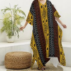 Stay cool and stylish with our Adinkra Print Women's Imitation Silk V-neck Kaftan Robe. Capture your memories in comfort and style with this must-have travel essential. Fabric: Imitation Silk(97% polyester and 3% spandex) Regular fit V-neck Fabric weight: 90g/m² Care Instruction: machine wash cold with similar colors, do not bleach, tumble dry low, do not iron, do not dry clean. Traditional Multicolor V-neck Kimono, Multicolor V-neck Kaftan With Batik Print, Traditional Multicolor V-neck Maxi Dress, Bohemian Multicolor V-neck Thobe, Traditional V-neck Maxi Dress With Batik Print, Traditional V-neck Thobe For Beach, Beach Kaftan With Traditional Patterns, Traditional V-neck Maxi Dress For Beach Cover-up, Traditional V-neck Kimono For Vacation