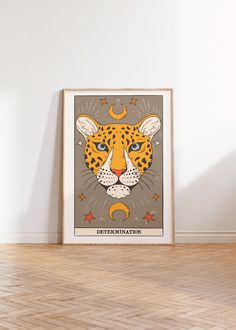 a poster with an animal's face on it in front of a white wall