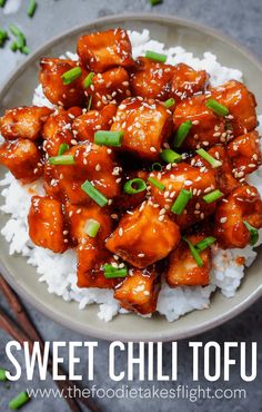 sweet and sour chicken served on rice with chopsticks