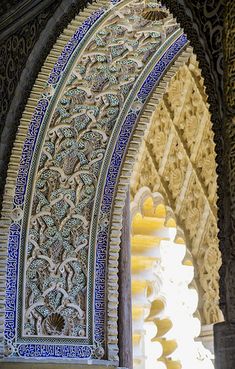 an ornate archway with blue and white tiles