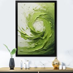 an abstract painting in green and white on a wall above a console table with vases