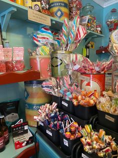 candy and candies are on display in the store's shelves, along with other items