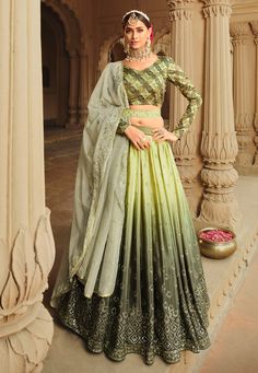 Green silk circular lehenga choli in Camo colour 2163  Desc:  Style : Circular Lehenga Choli Color : Camo Green Fabric : Silk Work : Embroidery   Sequence Wash Care : Dry clean Sleeve Style : Full Sleeve Long Sleeves : Done only in Custom Stitch Sleeves Lining : Done only in Custom Stitch Bust Size : 32 to 42 Inches Occasion : Wedding   Mehendi   Sangeet   Engagement   Reception   Ceremonial   Baby Shower   Teej. With Express Free Shipping and Custom Stitching, Buy Indian Party wedding wear brid Sequins Lehenga, Green Lehenga Choli, Ghaghra Choli, Women Marriage, Pista Green, Lengha Choli, Green Lehenga, Saree Gown, Lehenga Choli Online