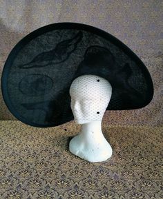 the iconic hat of cinderella's stepmother played by cate blanchett. asymmetrical brim in 4-layer black sinamay, macramé lace decorations, marinos wool felt dome, real black ostrich feathers, black silk velvet ribbon. just ask and your wishes will come true! Whimsical Black Adjustable Hat, Black Veiled Hat, Black Vintage Ceremonial Hat, Luxury Feather-trimmed Costume Hats And Headpieces For Women, Black Vintage Hat With Feathers, Cinderella Movie 2015, Cinderella Movie, Rose Hat, Macrame Lace