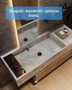 a bathroom sink sitting under a mirror next to a counter top with two faucets