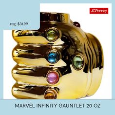 a gold colored vase with multicolored stones on it's sides and the words, marvel infinity gautet 20ozz