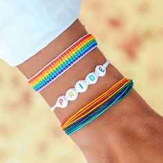 three different bracelets with the word beads written on them are shown in front of a person's arm