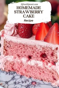 a close up of a slice of cake on a plate with strawberries and whipped cream