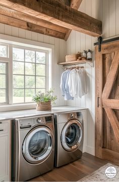 a washer and dryer in a small room with wooden beams on the ceiling