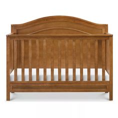 a wooden crib with no mattress in the front and side rails on the back