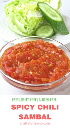 the recipe for spicy chilli sauce is in a glass bowl with lettuce and cucumbers