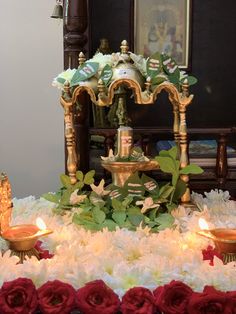 an elaborately decorated altar with candles and flowers