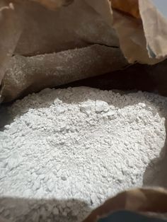 a bag filled with white powder sitting on top of a table