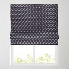 a window with a blue roman blind in front of it