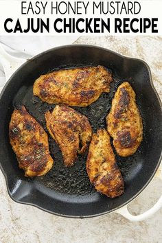 chicken cooking in a skillet with the words easy honey mustard cajun chicken recipe