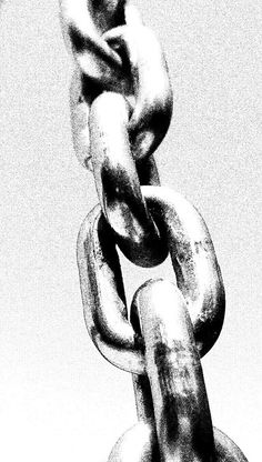 a black and white photo of a chain with two links hanging from it's end