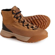 a pair of brown hiking boots on a white background