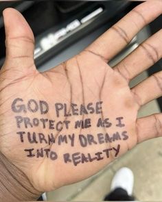 a hand with writing on it that says, god please protect me as i turn my dreams into reality