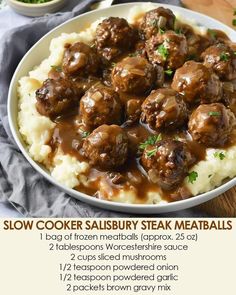 a bowl filled with meatballs and gravy on top of mashed potatoes