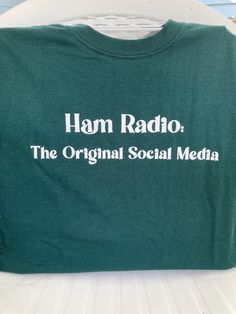 Ham Radio is the Original Social Media T shirt, amateur radio shirt,ham radio shirt, social media & ham radio  Screenprinted on olive green or dark green with white ink or ash  gray t shirt with royal blue ink. Also available made to order -Long-sleeve T's, Tall, T's or Sweatshirts-Crewneck or Hoodie, please convo me & I will post that particular shirt for you to purchase. Sweatshirts Crewneck, Ash Gray, Amateur Radio, Ham Radio, Blue Ink, White Ink, Gray Tshirt, Dark Green, Olive Green