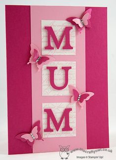 a pink card with butterflies and the word mum on it