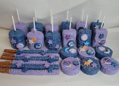 purple and blue cupcakes with stars on them