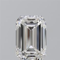 an emerald cut diamond on a gray background