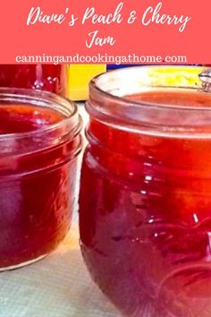 two jars filled with jam sitting on top of a table