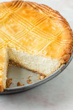 a pie sitting on top of a pan with one slice missing from it's crust