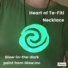 a woman wearing a green glow in the dark t - shirt with a spiral design on it