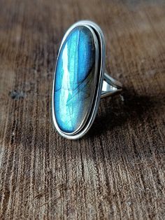 Handmade labradorite bohemian ring , you can wear this ring as a party wear ring .. Title -labradorite stone ring Stone color - blue Stone shape - oval Material - Sterling silver 925 Note - This is natural stone so shade may be little bit different .. we are giving you best quality rings on best price .. contact us for more quantity Bohemian Sterling Silver Moonstone Open Ring, Bohemian Sterling Silver Cabochon Moonstone Ring, Bohemian Sterling Silver Cabochon Crystal Ring, Bohemian Moonstone Crystal Ring With Open Design, Bohemian Jewelry With Large Moonstone, Bohemian Moonstone Ring With Large Stone For Gift, Bohemian Moonstone Jewelry With Large Stone, Bohemian Moonstone Cabochon Crystal Ring, Bohemian Moonstone Crystal Ring With Cabochon