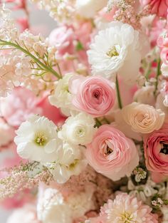 pink and white flowers are in a vase