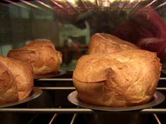 three muffins sitting on plates in an oven